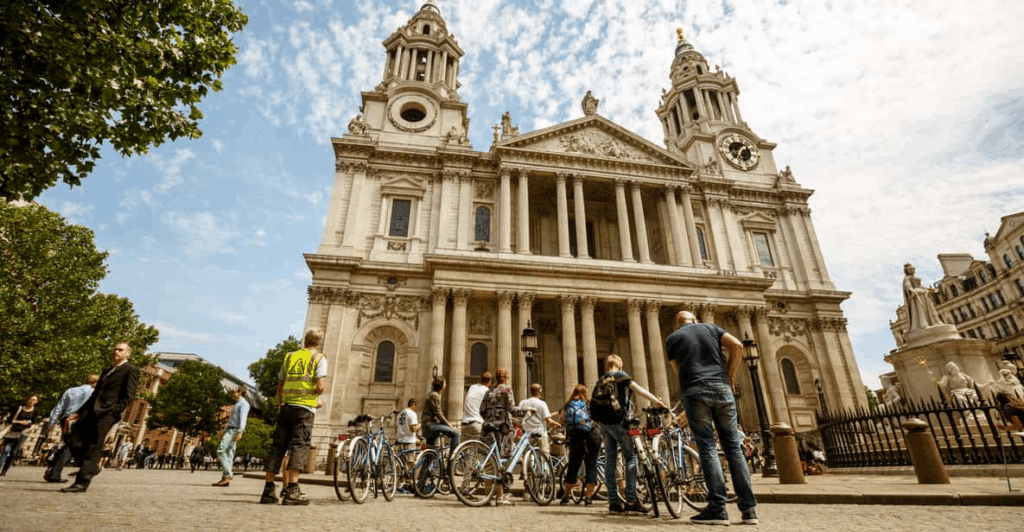 A bicycle tour with their tour guide in central London on a London Bike Tour