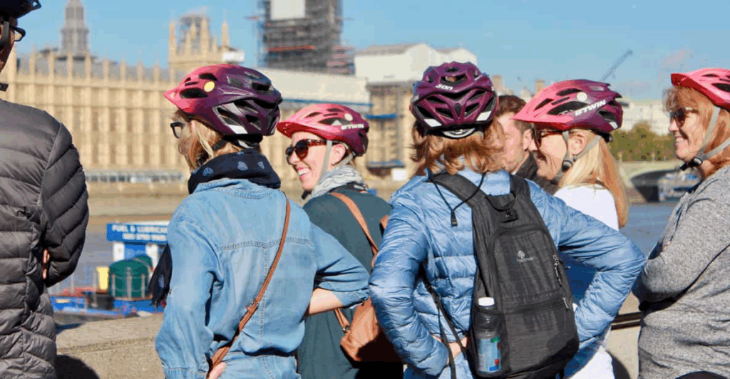 A close up of a bicycle tour group in front of Big Ben on a London Bike Tour