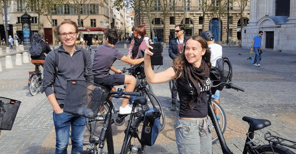 A group small group of cyclists with  on a Paris Bike Tour