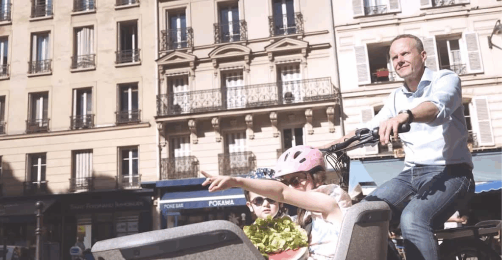A family enjoying a Kids Bike tour in Paris as part of a Paris Bike Tours for Families