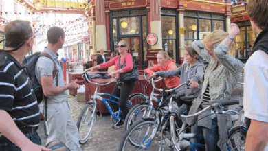 Families on bikes in an old London food arcade on a London private tours